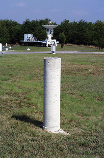 One of the reference monuments at GGAO. The MV-3 system and GODE GPS monument can be seen in the background.