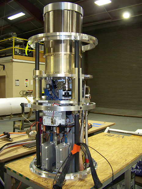 The removable support hardware sled with post-dewar electronics is in the foreground of this photo taken of the complete frontend payload. Cryogenic coolant cables and components are accessed from the other side.