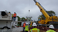 The dome ring is lifted to be placed on the shelter