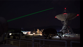 Laser ranging station with laser pointing into the darkness