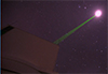 Laser beam pointing at moon