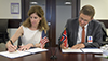 Karen Feldstein, NASA Deputy Associate Administrator for International and Interagency Relations and Per Erik Opseth, Director, Geodetic Institute of the Norwegian Mapping Authority signing the agreement.